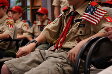 Scouts in uniform at a troop meeting